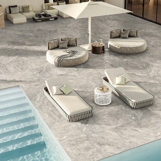 Travertino Sterling Porcelain Paver around a swimming Pool