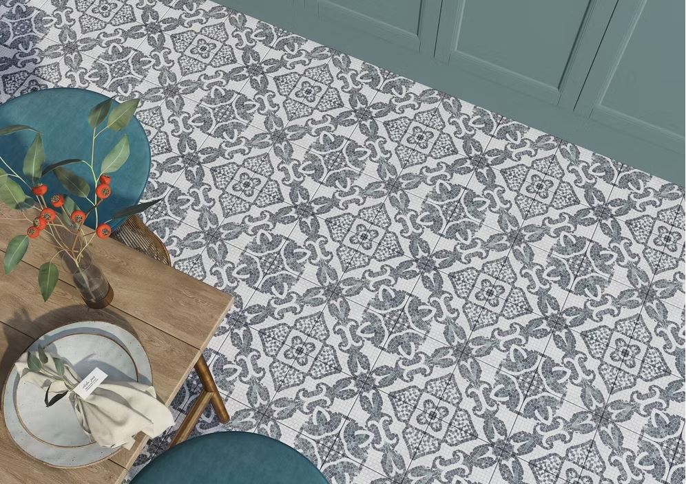 kitchen interior with table and teal coloured cabinets, showcasing Versailles Attano patterned floor tiles in grey and white mosaic tones.